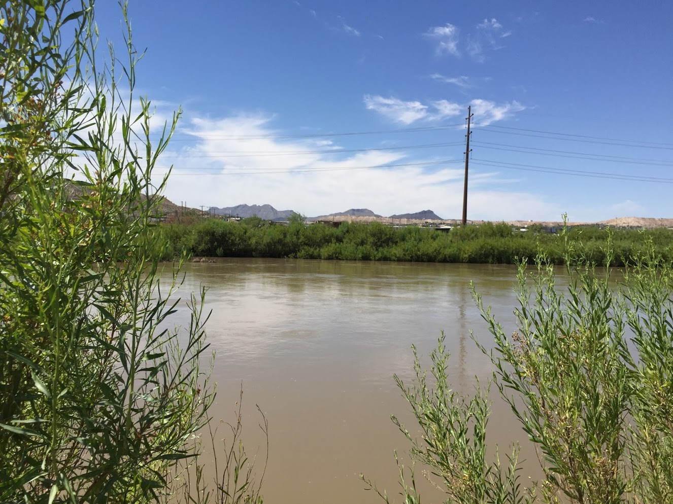 Water of the Rio Grande River. No swimming and no fishing allowed due to unhealthy water. 