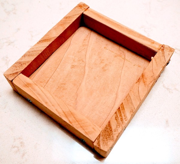 The unfinished wooden tray.