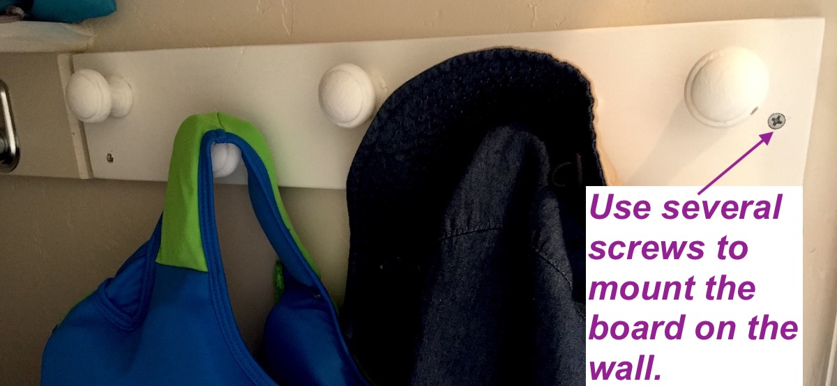 Wall-mounted coat rack. Use screws to mount the rack on the wall.